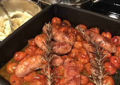 Sausages & mash with roasted tomatoes